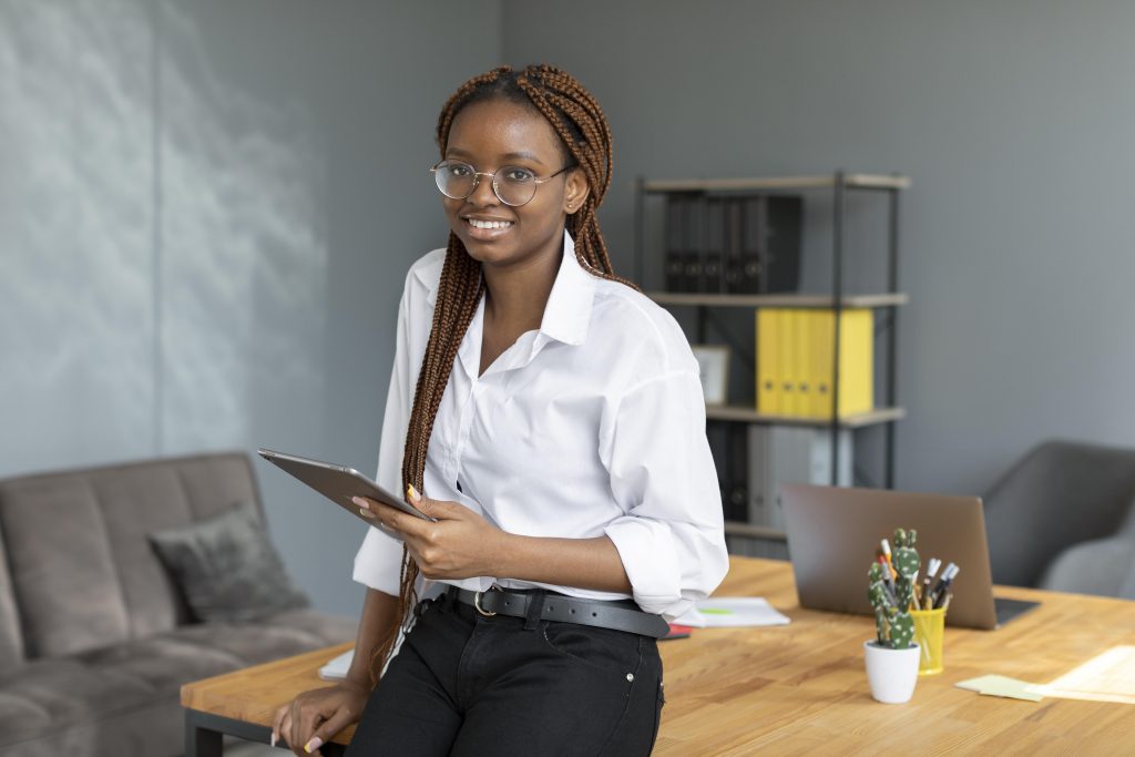 young woman holding tablet work